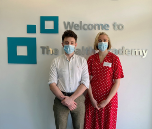 Two fourth year University of Manchester students, Hetty and Fionn at the Health Academy